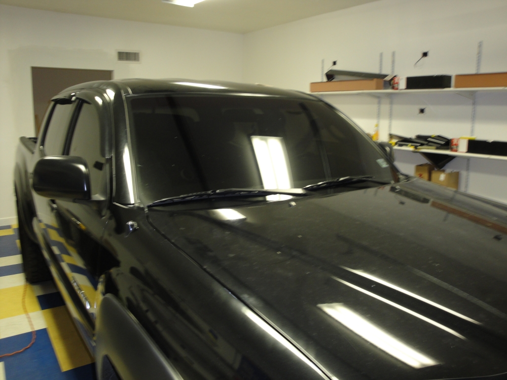 Black truck with a tinted windshield